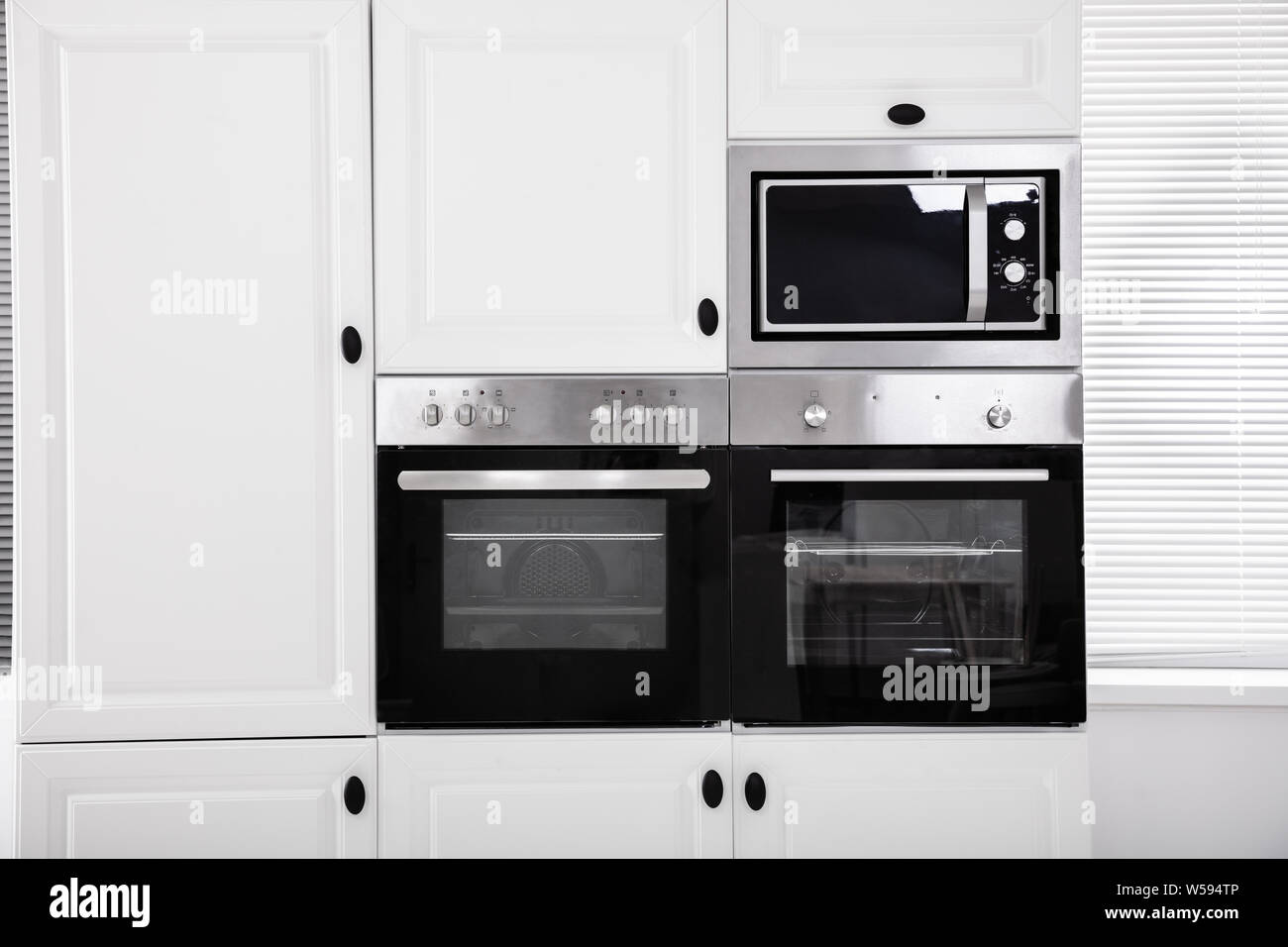 Modern hi-tek kitchen, oven with door open Stock Photo by ©starush