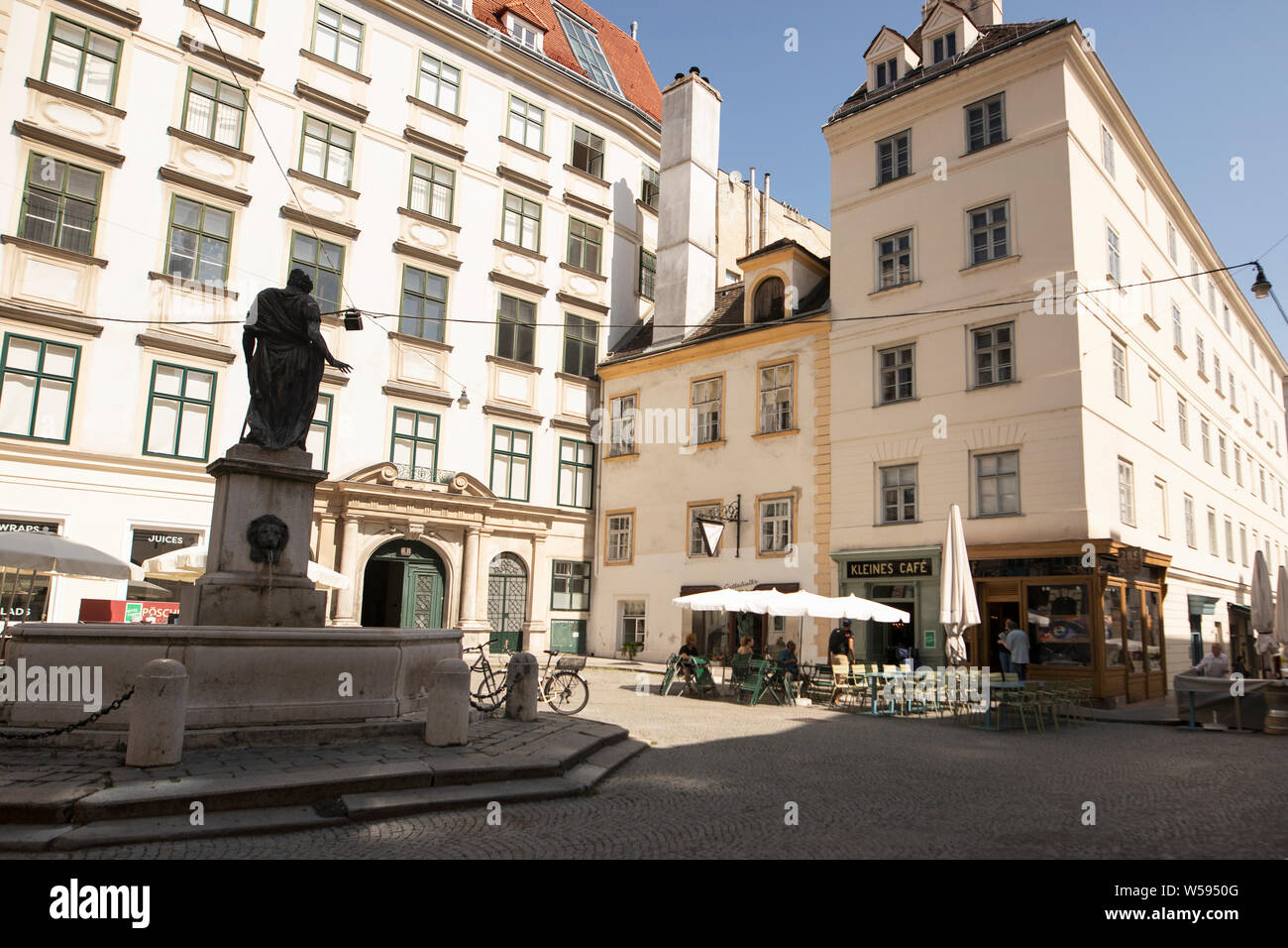 The fountain and the Kleines Cafe at Franziskanerplatz in Vienna, Austria. Stock Photo