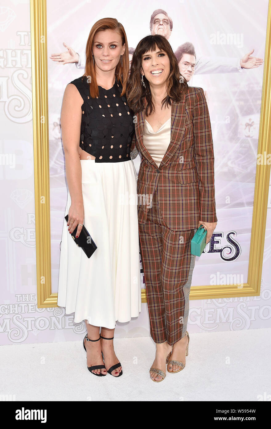 HOLLYWOOD, CA - JULY 25: Cassidy Freeman (L) and Edi Patterson attend the Los Angeles Premiere Of New HBO Series 'The Righteous Gemstones' at Paramount Studios on July 25, 2019 in Hollywood, California. Stock Photo