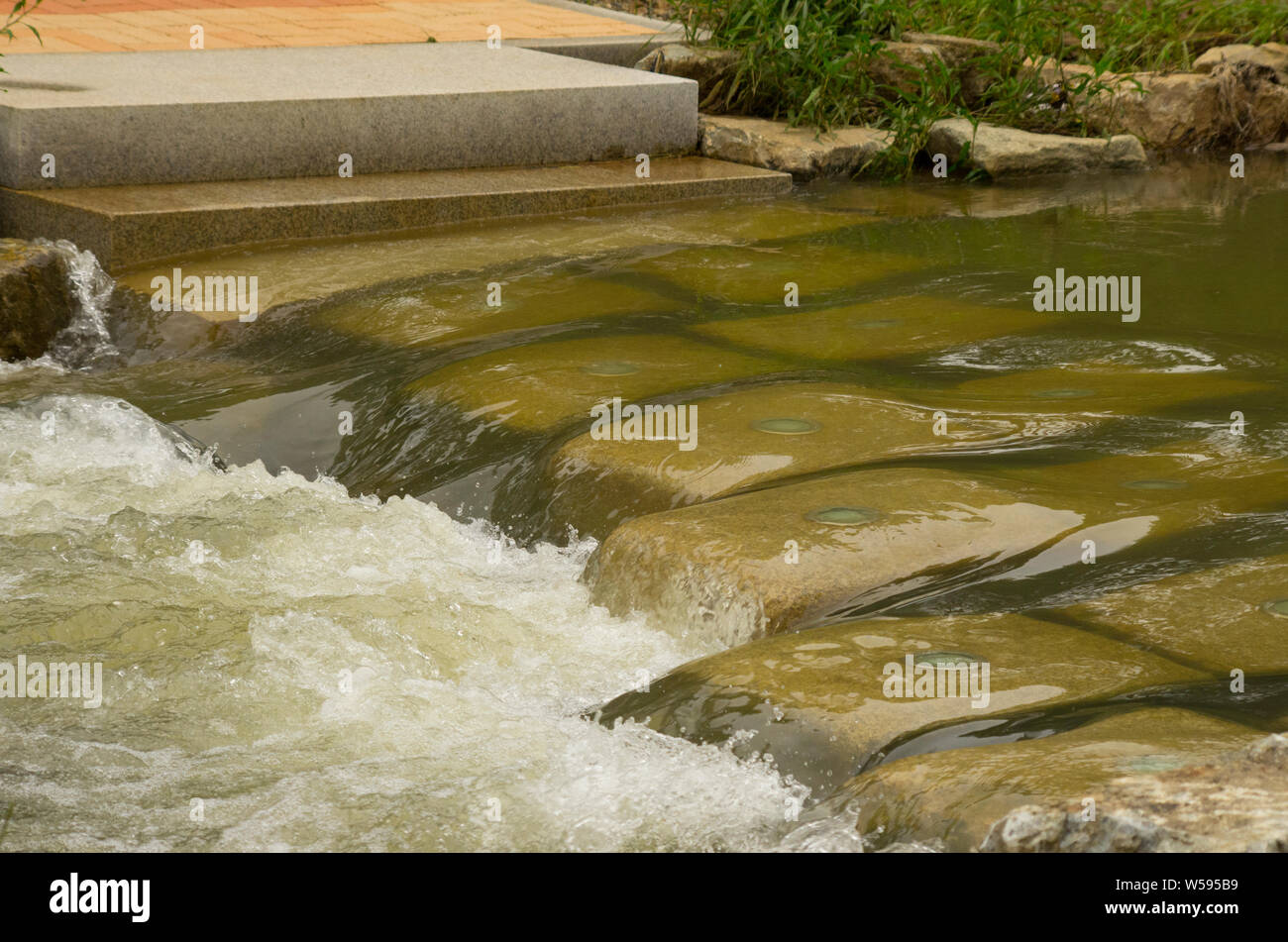 current of stream on stone steps Stock Photo Alamy