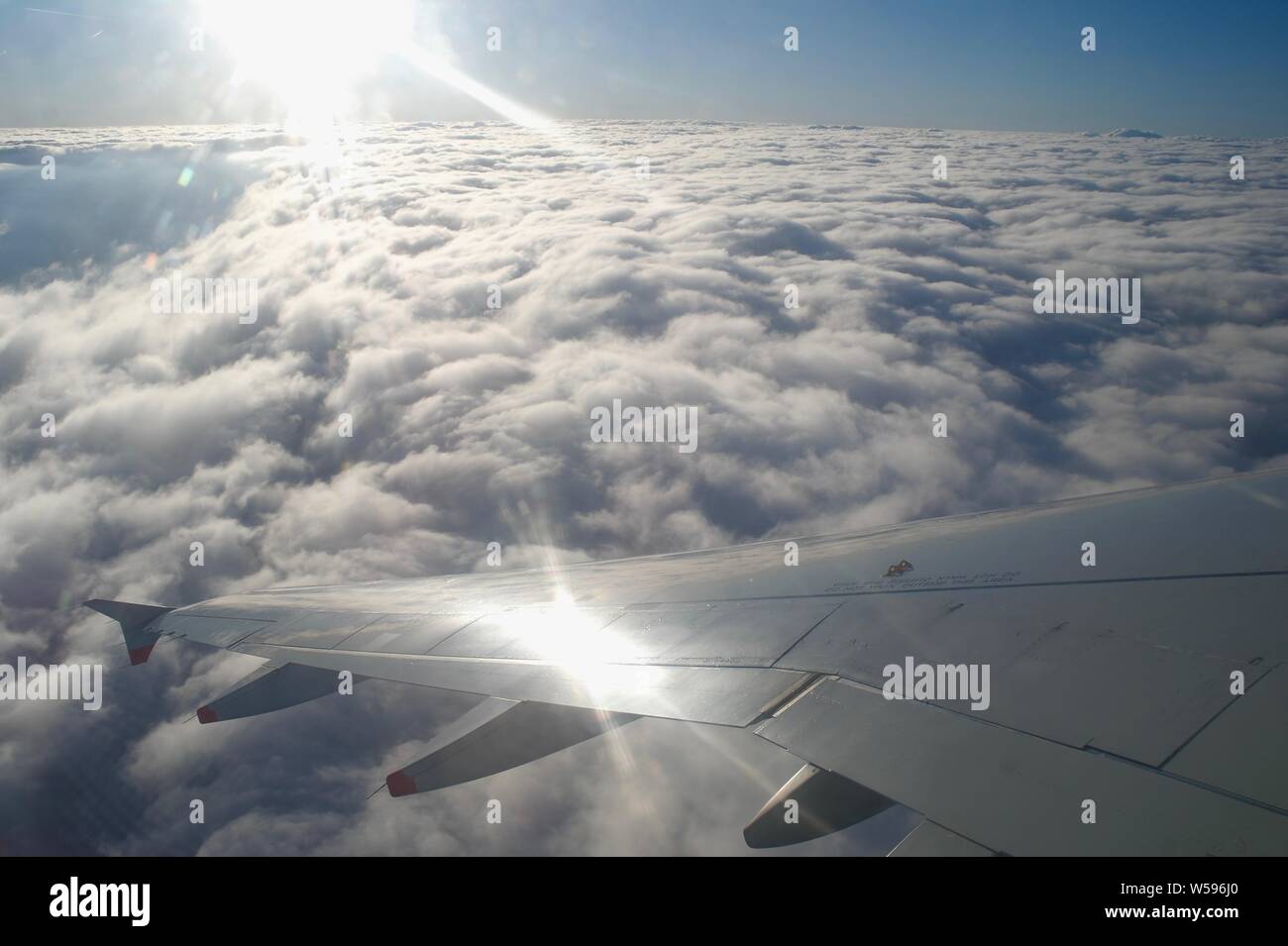 Sunshine above the cloud tops, climbing out of Gatwick Airport Stock Photo