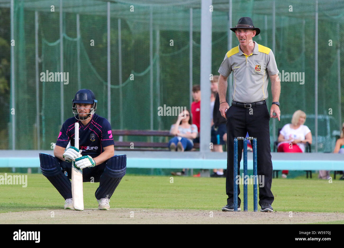 The Lawn, Waringstown, Northern Ireland, UK. 26th July, 2019. The Lagan Valley Steels Twenty 20 Cup Final 2019. CIYMS v iWaringstown (red). Action from this evening's final. Credit: David Hunter/Alamy Live News. Stock Photo