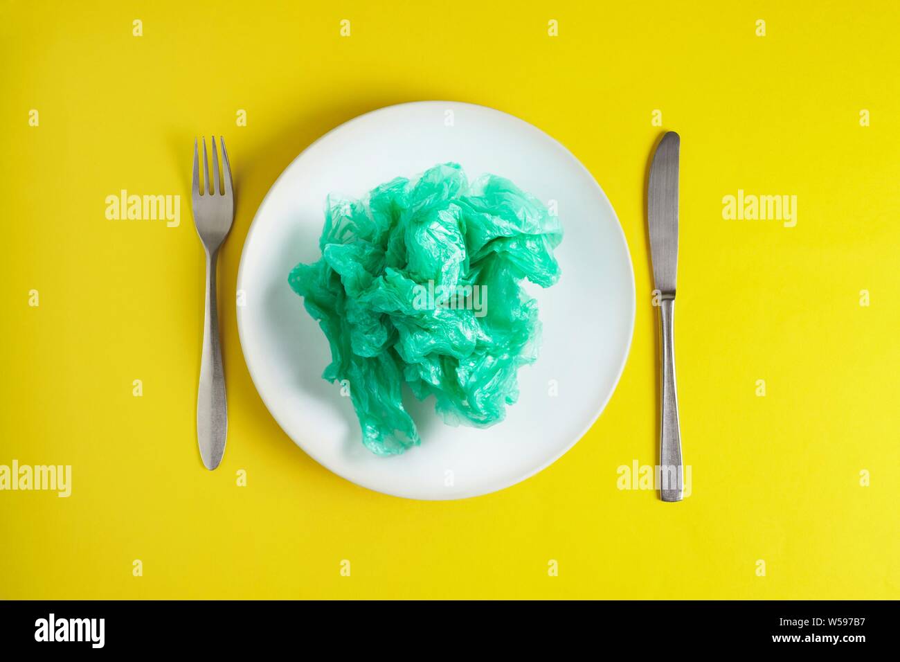 Conceptual image of plastic pollution entering the food chain. Stock Photo