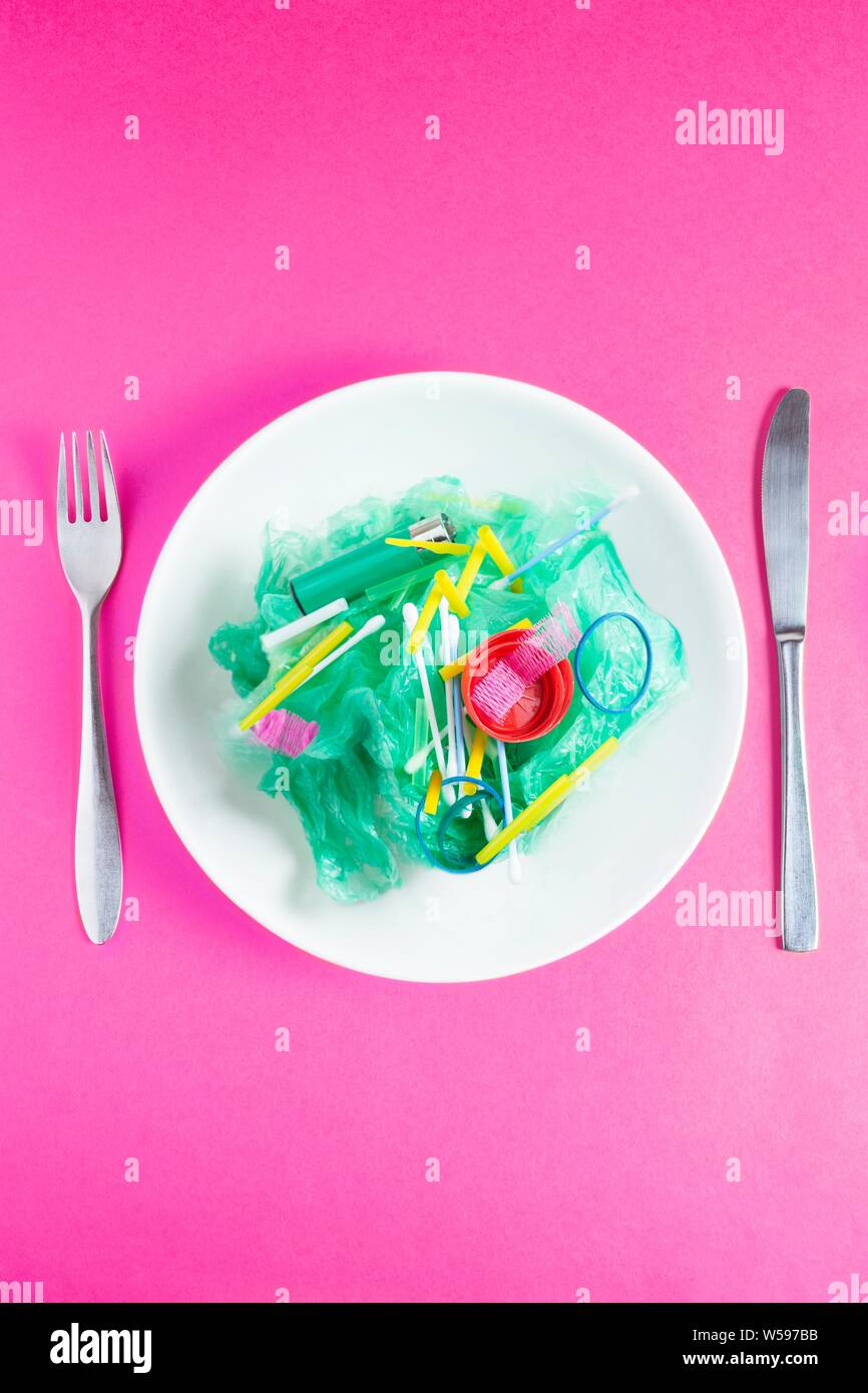 Conceptual image of plastic pollution entering the food chain. Stock Photo