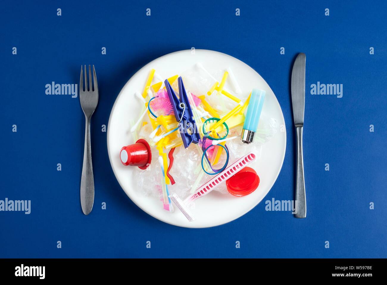 Conceptual image of plastic pollution entering the food chain. Stock Photo