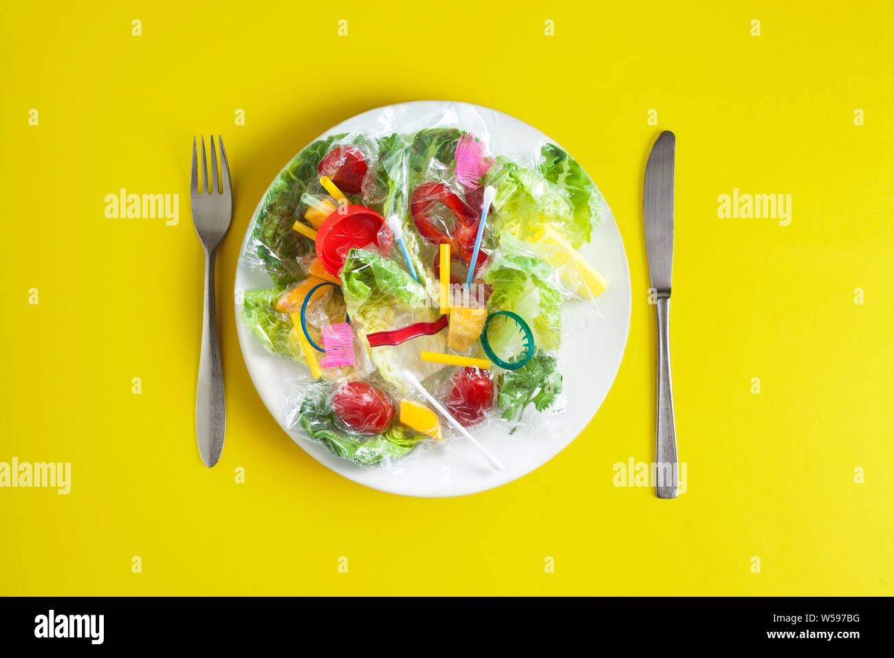 Conceptual image of plastic pollution entering the food chain. Stock Photo