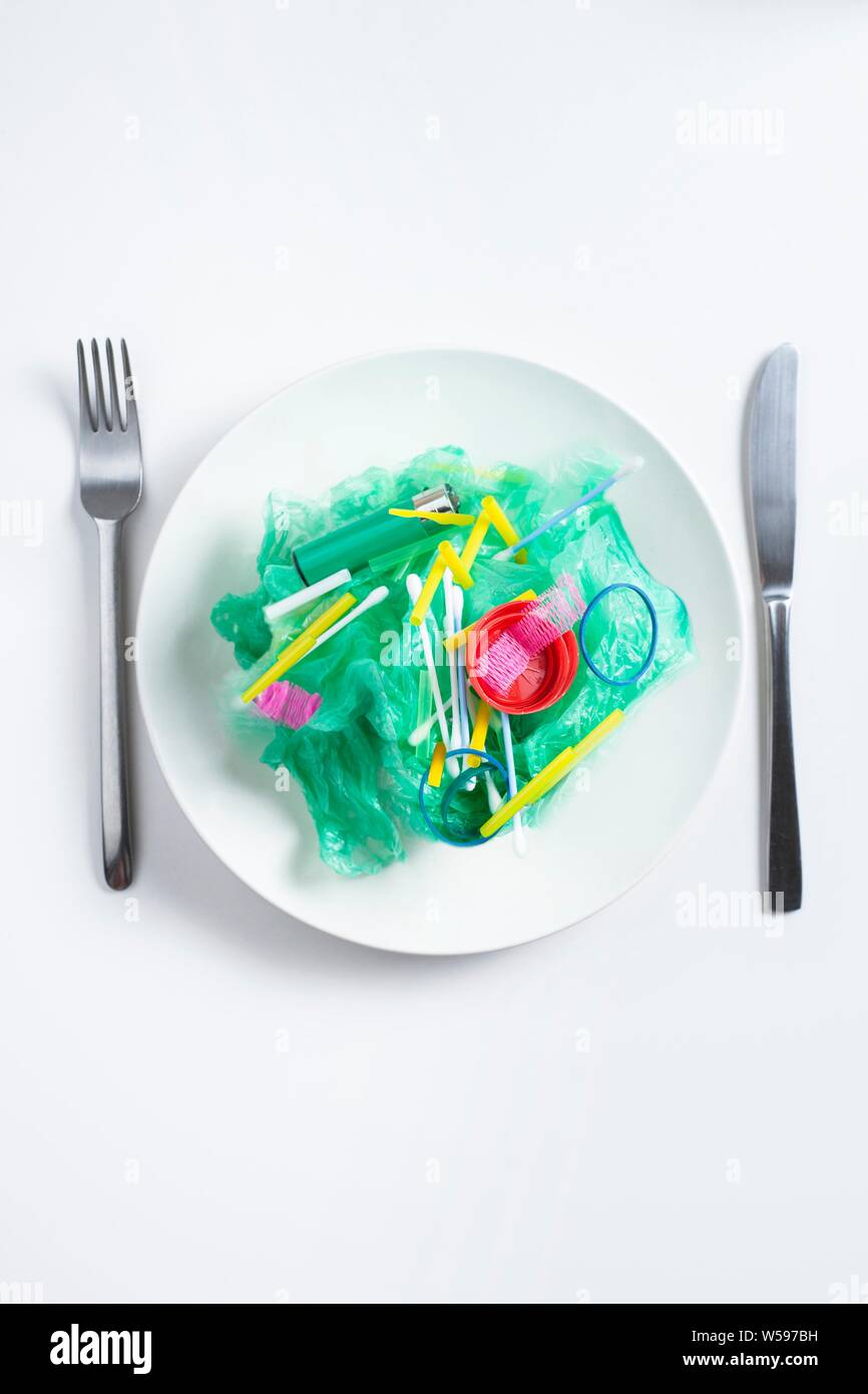 Conceptual image of plastic pollution entering the food chain. Stock Photo