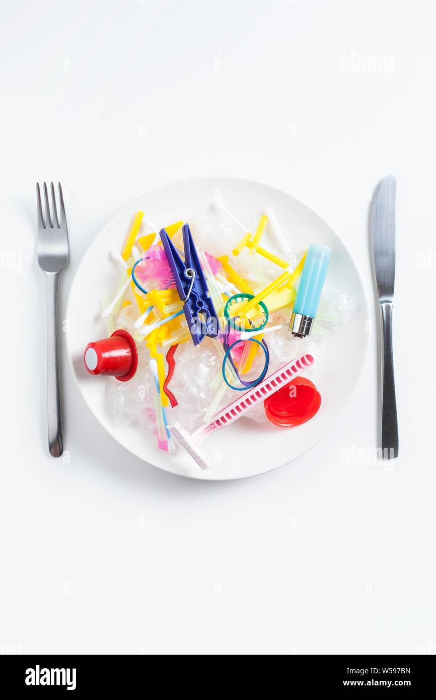 Conceptual image of plastic pollution entering the food chain. Stock Photo