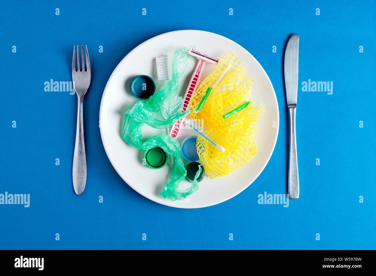 Conceptual image of plastic pollution entering the food chain. Stock Photo