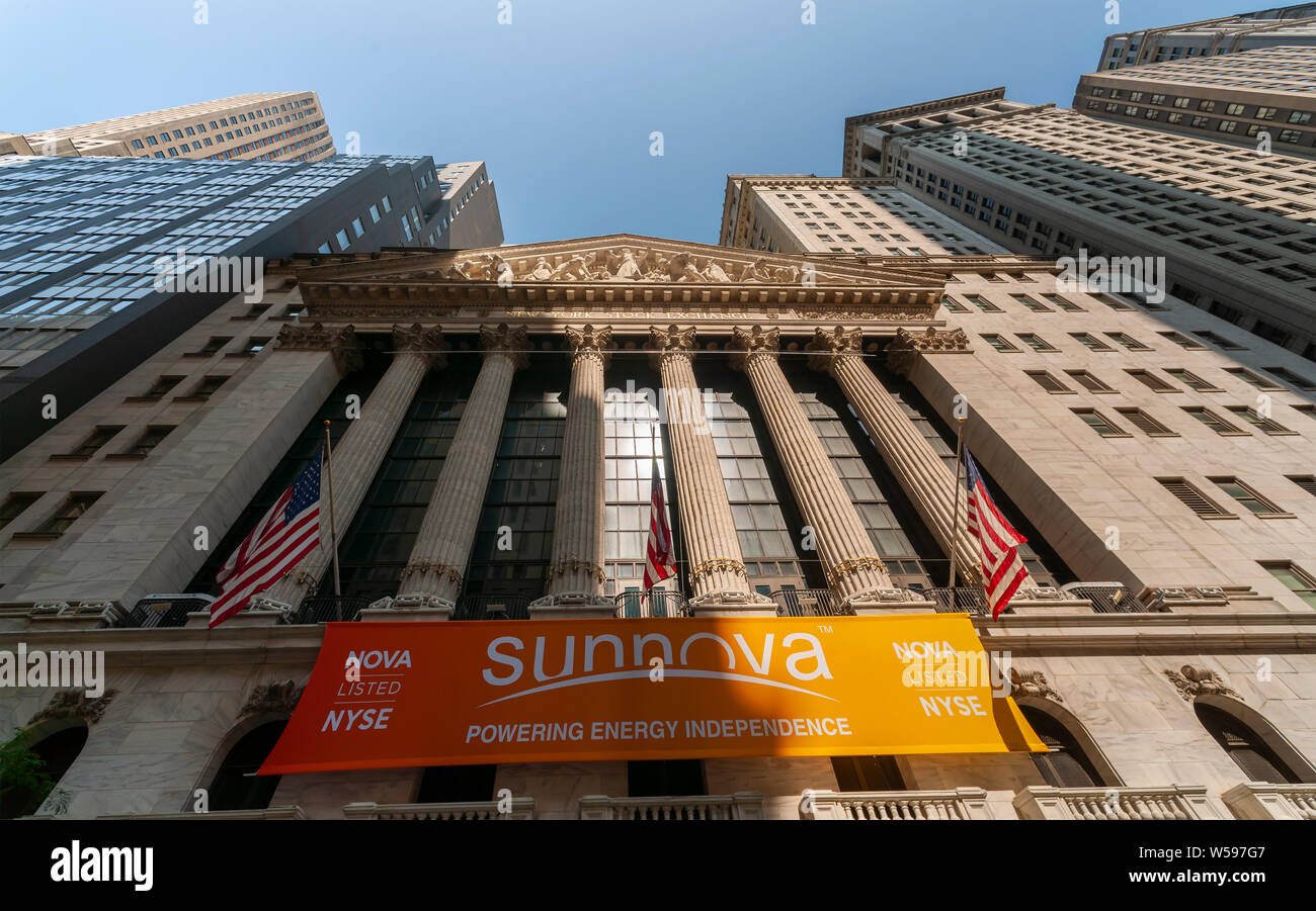 The New York Stock Exchange in Lower Manhattan in New York on Thursday, July 25, 2019 is decorated with a banner for the Sunnova initial public offering. Sunnova Energy International is a provider of solar energy systems and services for residences.  (© Richard B. Levine) Stock Photo