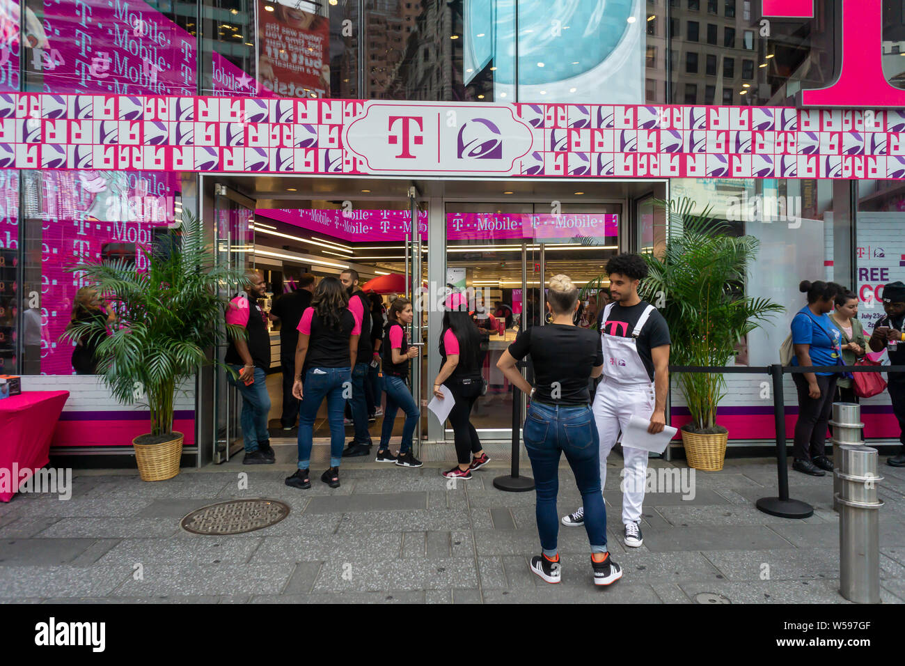 Hundreds of taco lovers descend on the T-Mobile store in Times Square in New York on Taco Tuesday, July 23, 2019 for TacoBell tacos, T-MoBell Freeze slushies and assorted free swag. The collaboration with Taco Bell rebranded the stores as ÒT-MoBellÓ. The crossover event takes over the store for three days bringing in the mobile phone loving, taco eating demographic. (© Richard B. Levine) Stock Photo