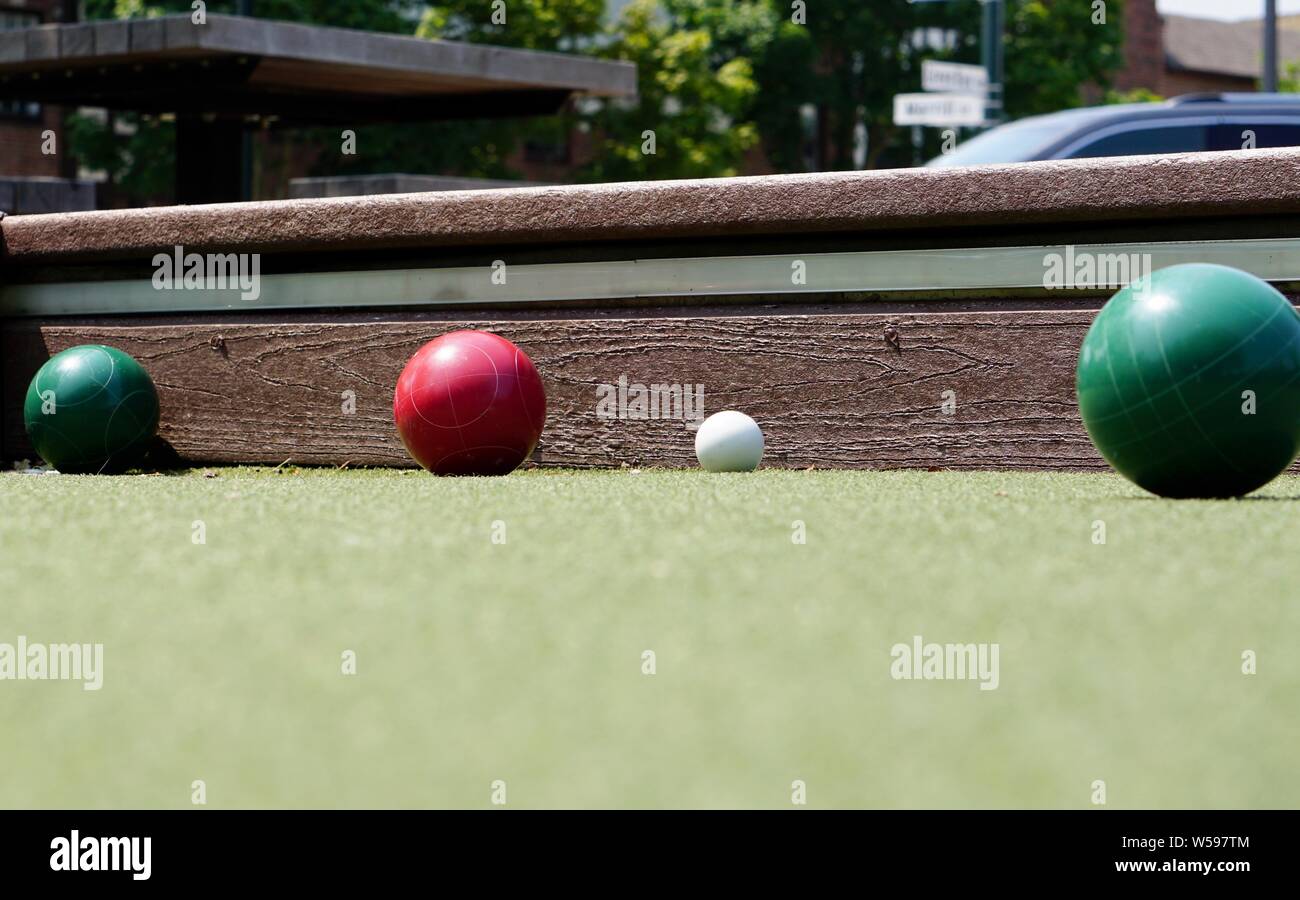 Summer afternoon at the bocce court in a public park. Stock Photo