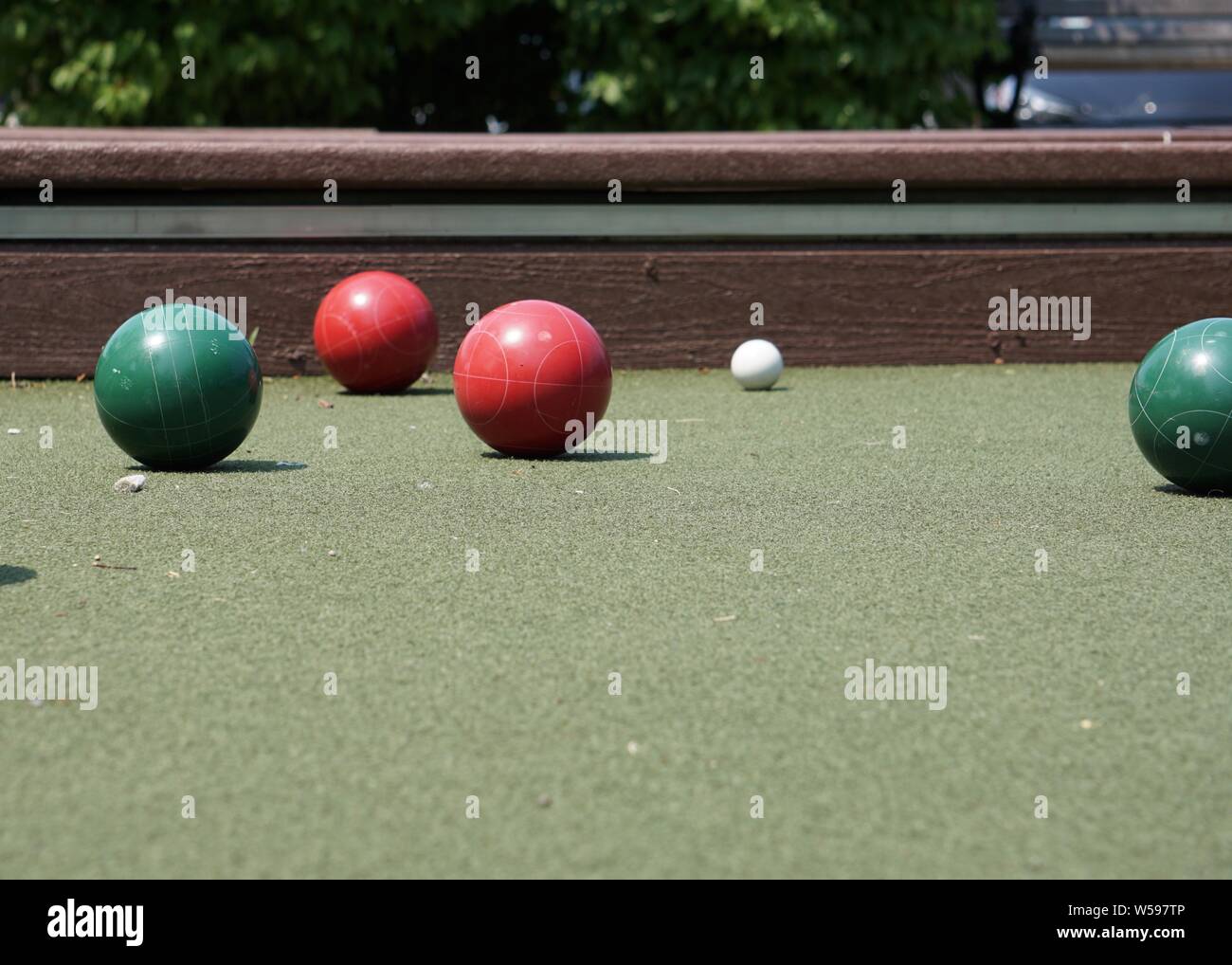 Summer afternoon at the bocce court in a public park. Stock Photo