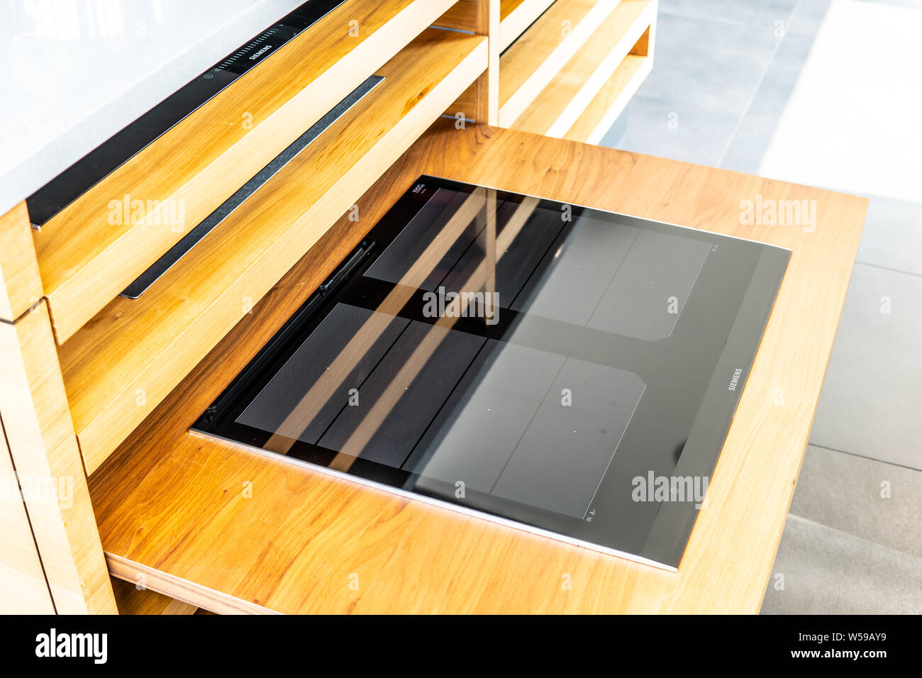 inside showroom, Siemens gas, electric, induction hobs, cooktop and Built-in ovens from manufacturer of home appliances Stock Photo