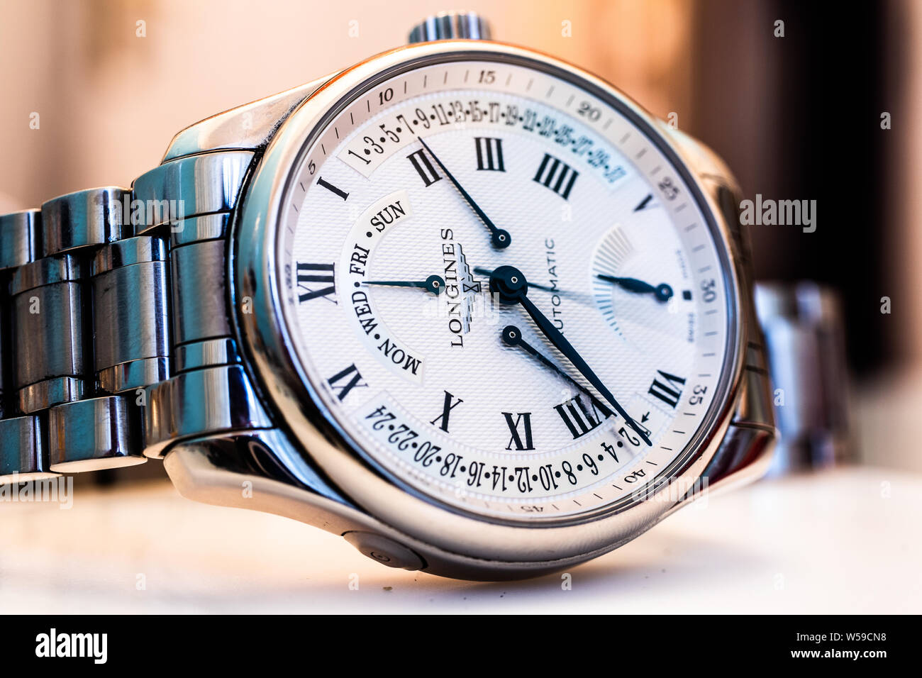 Lodz, Poland, Apr 2019 Longines hand watch, macro, luxury watch company, Longines winged hourglass logo registered 1889 is oldest unchanged trademark Stock Photo