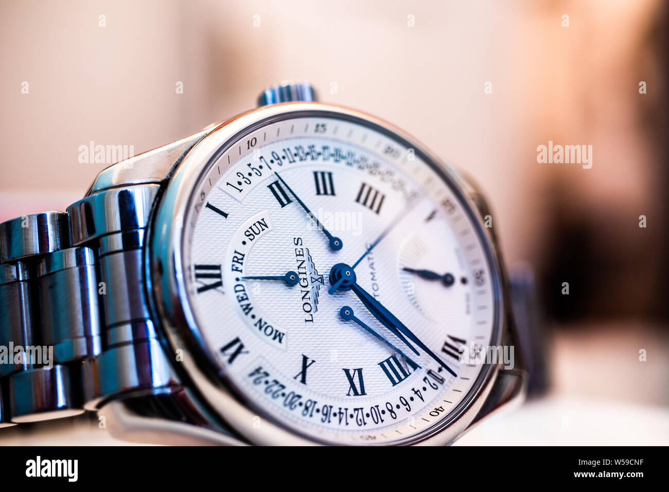 Lodz, Poland, Apr 2019 Longines hand watch, macro, luxury watch company, Longines winged hourglass logo registered 1889 is oldest unchanged trademark Stock Photo