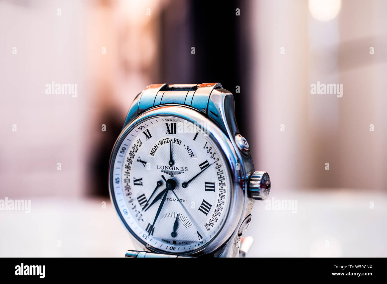 Lodz, Poland, Apr 2019 Longines hand watch, macro, luxury watch company, Longines winged hourglass logo registered 1889 is oldest unchanged trademark Stock Photo