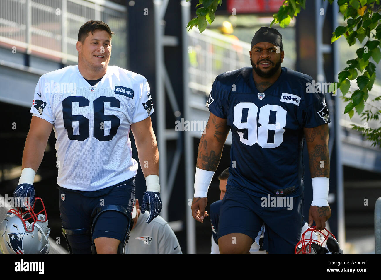 Foxborough, Massachusetts, USA. 26th July, 2019. New England Patriots  offensive lineman James Ferentz (66) and defensive lineman Mikke Pennel Jr.  (98) at the New England Patriots training camp held on the practice