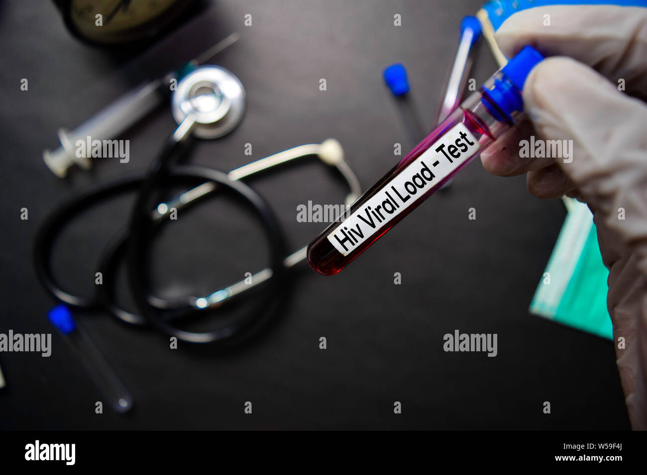 Hiv Viral Load Test with blood sample. Top view isolated on black background. Healthcare