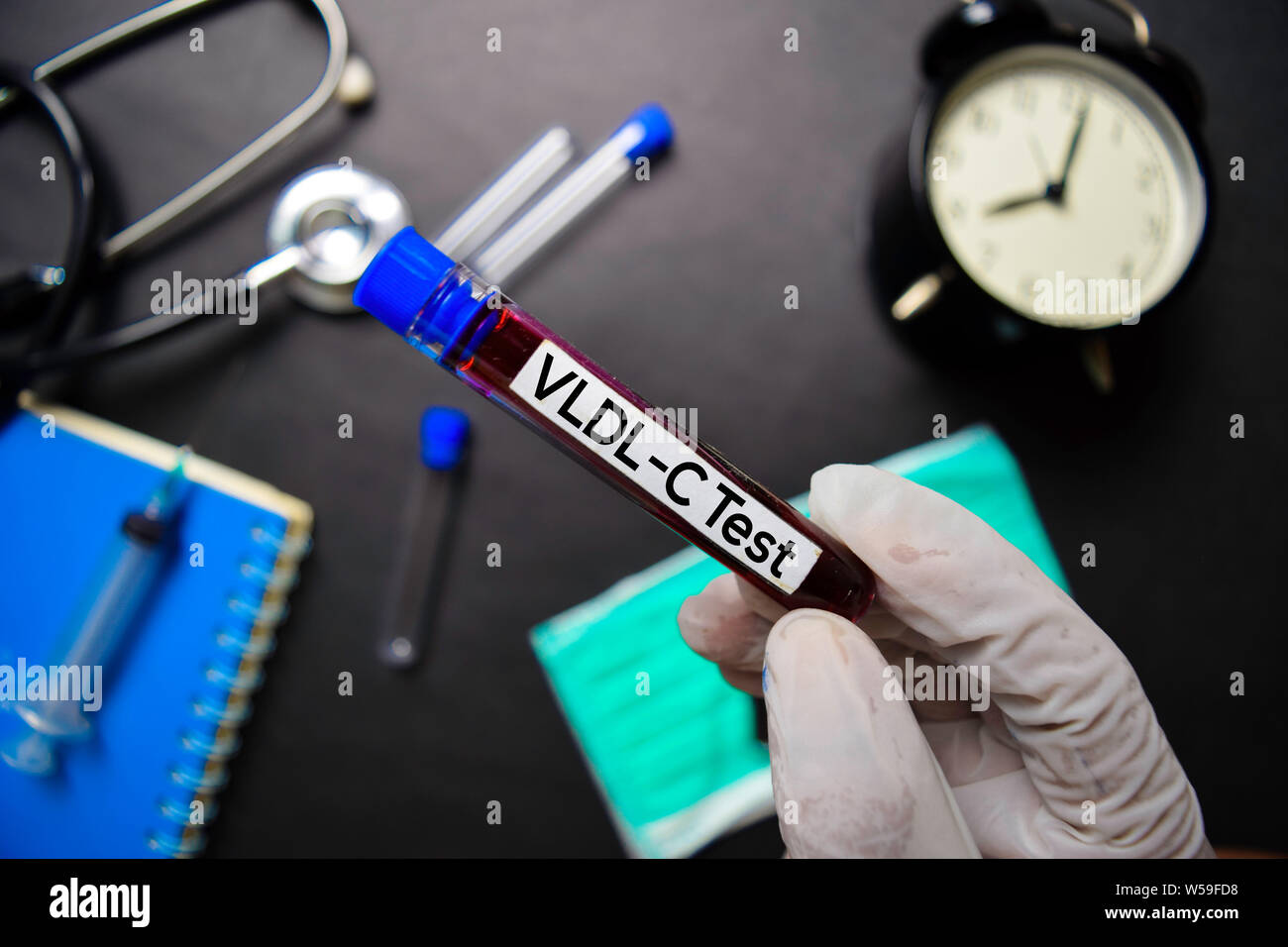 VLDLC Test with blood sample. Top view isolated on black background