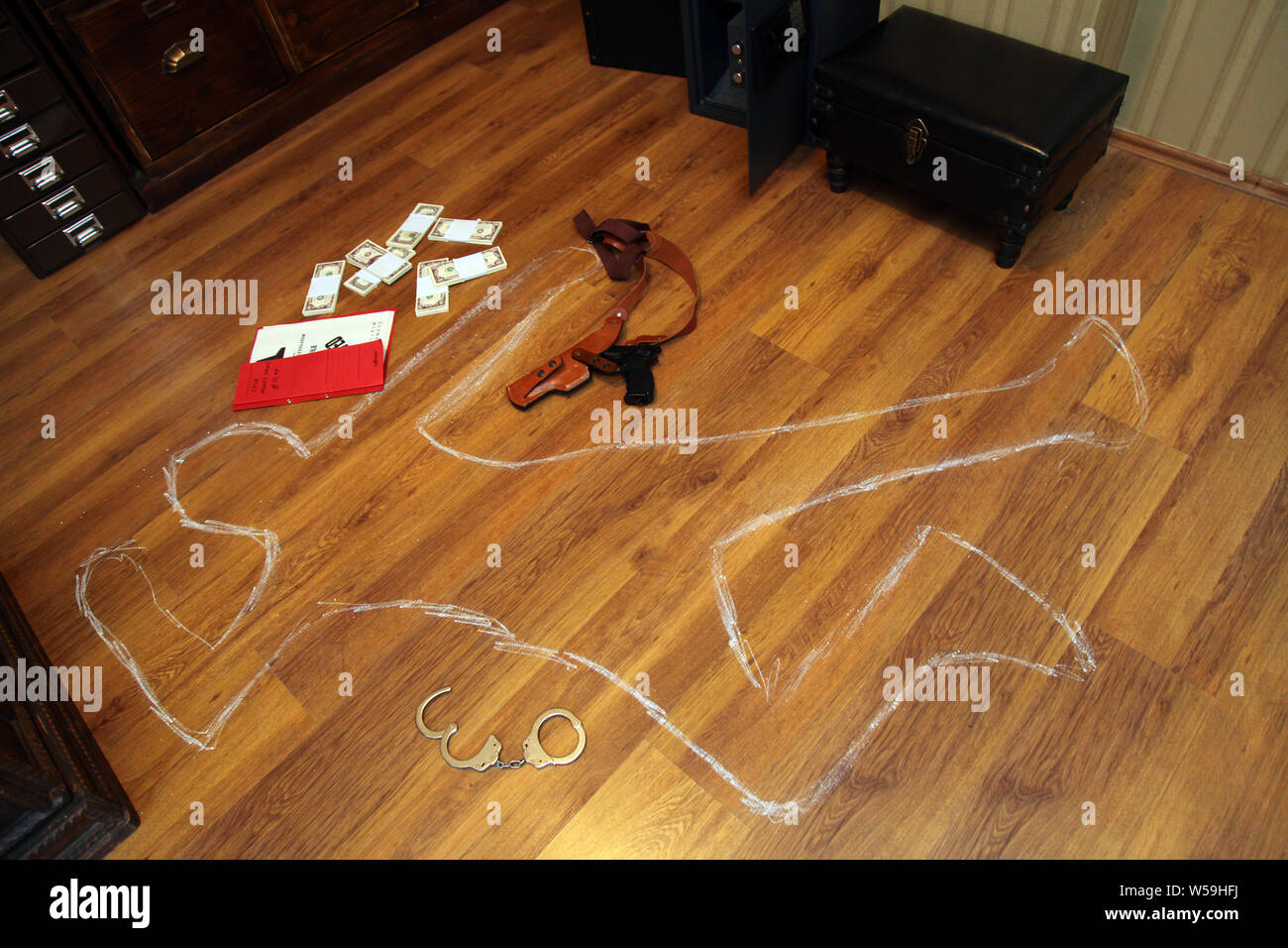 Gun, money, handcuffs and secret files in the crime scene Stock Photo