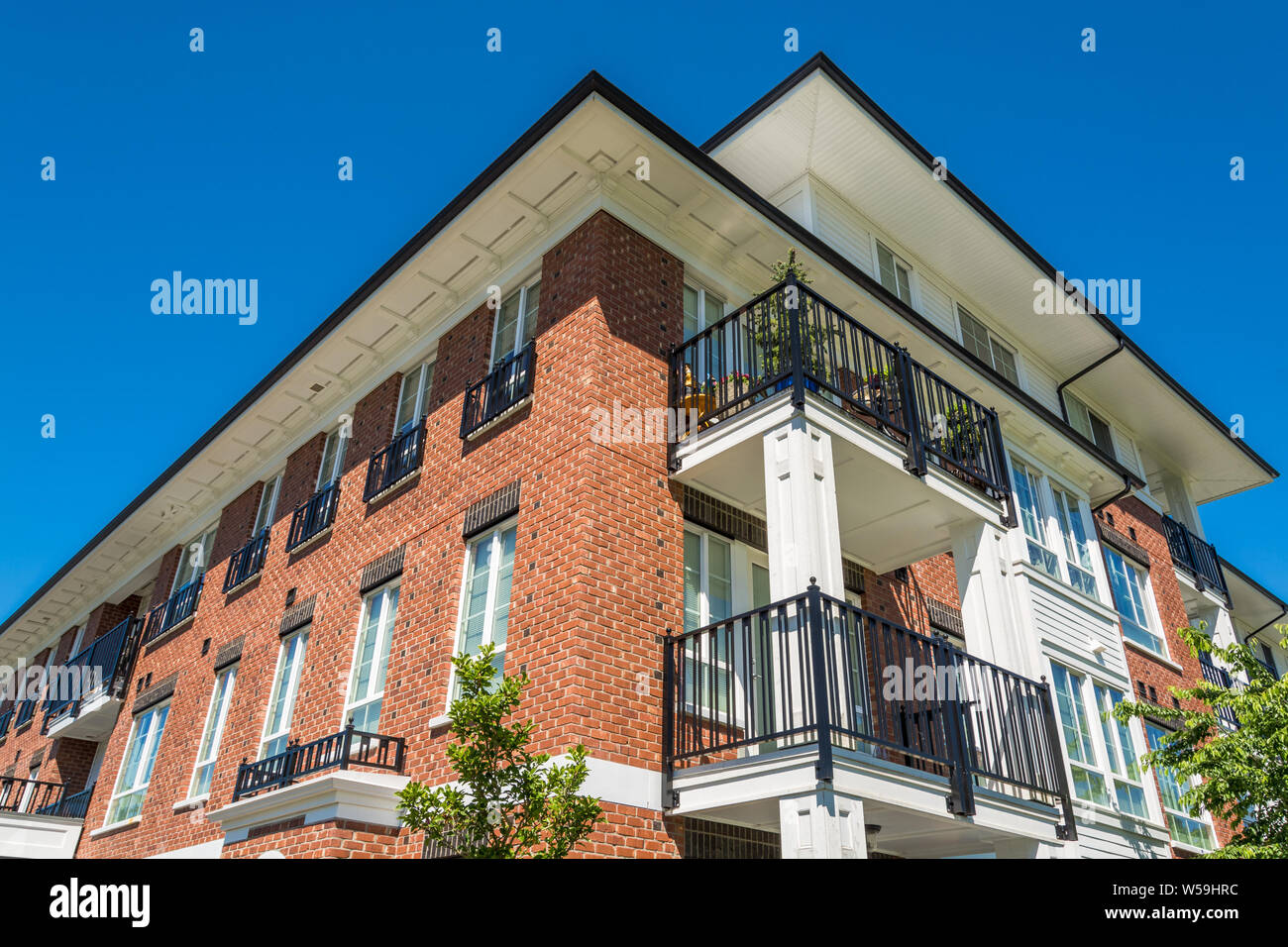 The top of brand new apartment building on blue sky background Stock ...