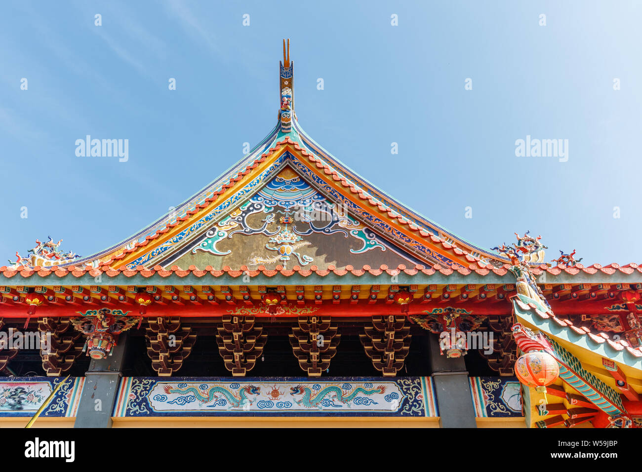 Colorful roof of Vihara Satya Dharma, Chinese Buddhist temple, honoring Tianhou Mazu, Chinese sea goddess. Benoa port, Bali, Indonesia. Stock Photo