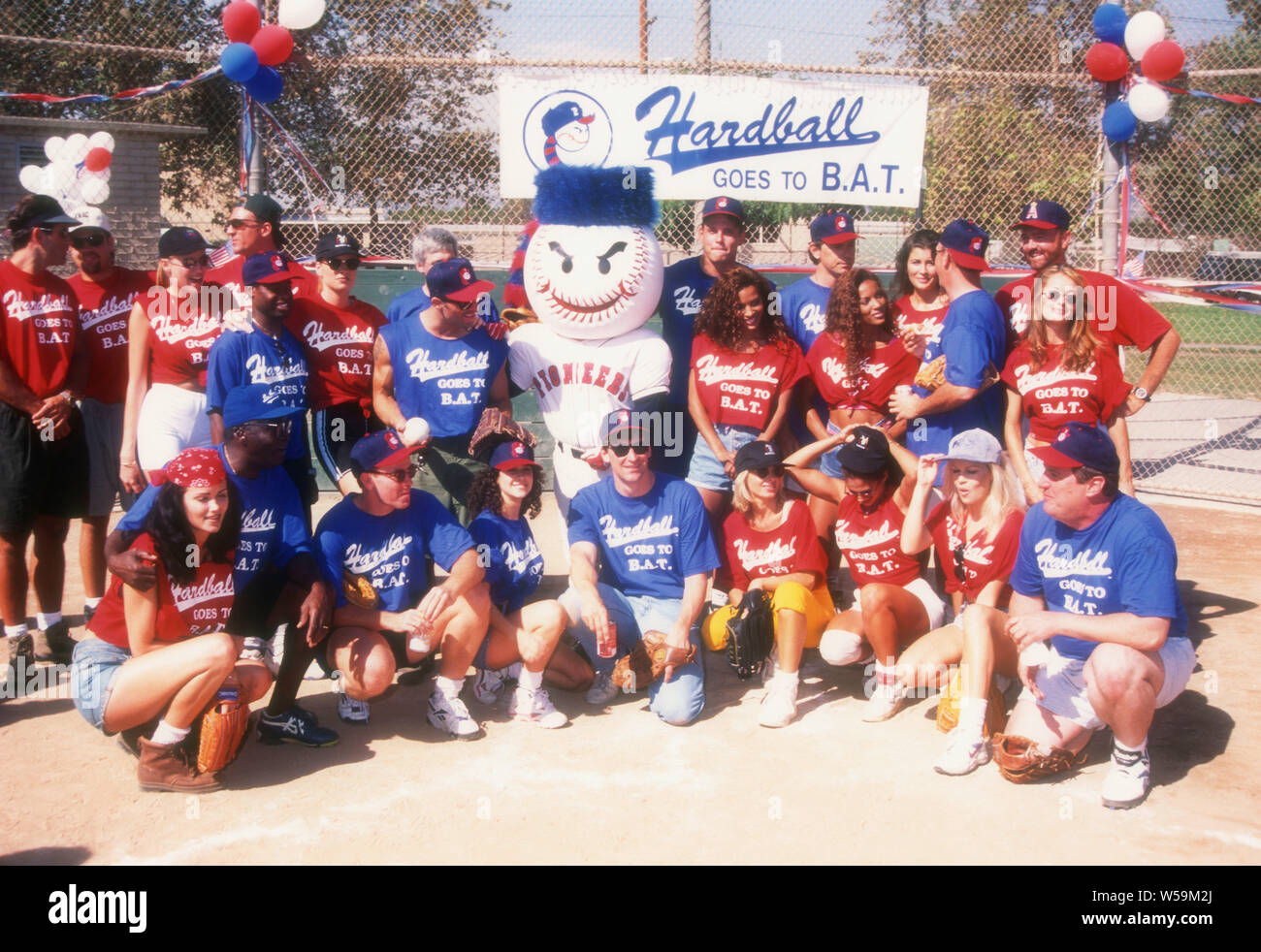 Los Angeles, California, USA 12th October 1994 Actor Mike Starr, actor Dann Florek, Comedian/actor Joe Rogan, actor Chris Browning, actor Bruce Greenwood, actor Steve Hytner and actor Phill Lewis, model Traci Adell, models/twins Rosie Tenison and Renee Tenison attend Hardball Goes To B.A.T. baseball game on October 12, 1994 in Los Angeles, California, USA. Photo by Barry King/Alamy Stock Photo Stock Photo