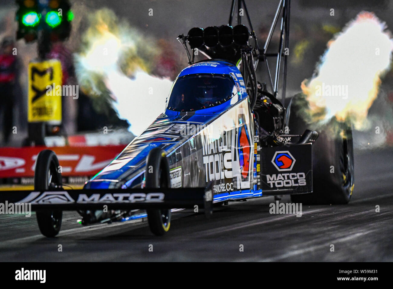 Sonoma, California, USA. 26th July, 2019. Antron Brown trickles the tires and lights the fires starting his Match Tools top fuel dragster during the NHRA Sonoma Nationals at Sonoma Raceway in Sonoma, California. Chris Brown/CSM/Alamy Live News Stock Photo
