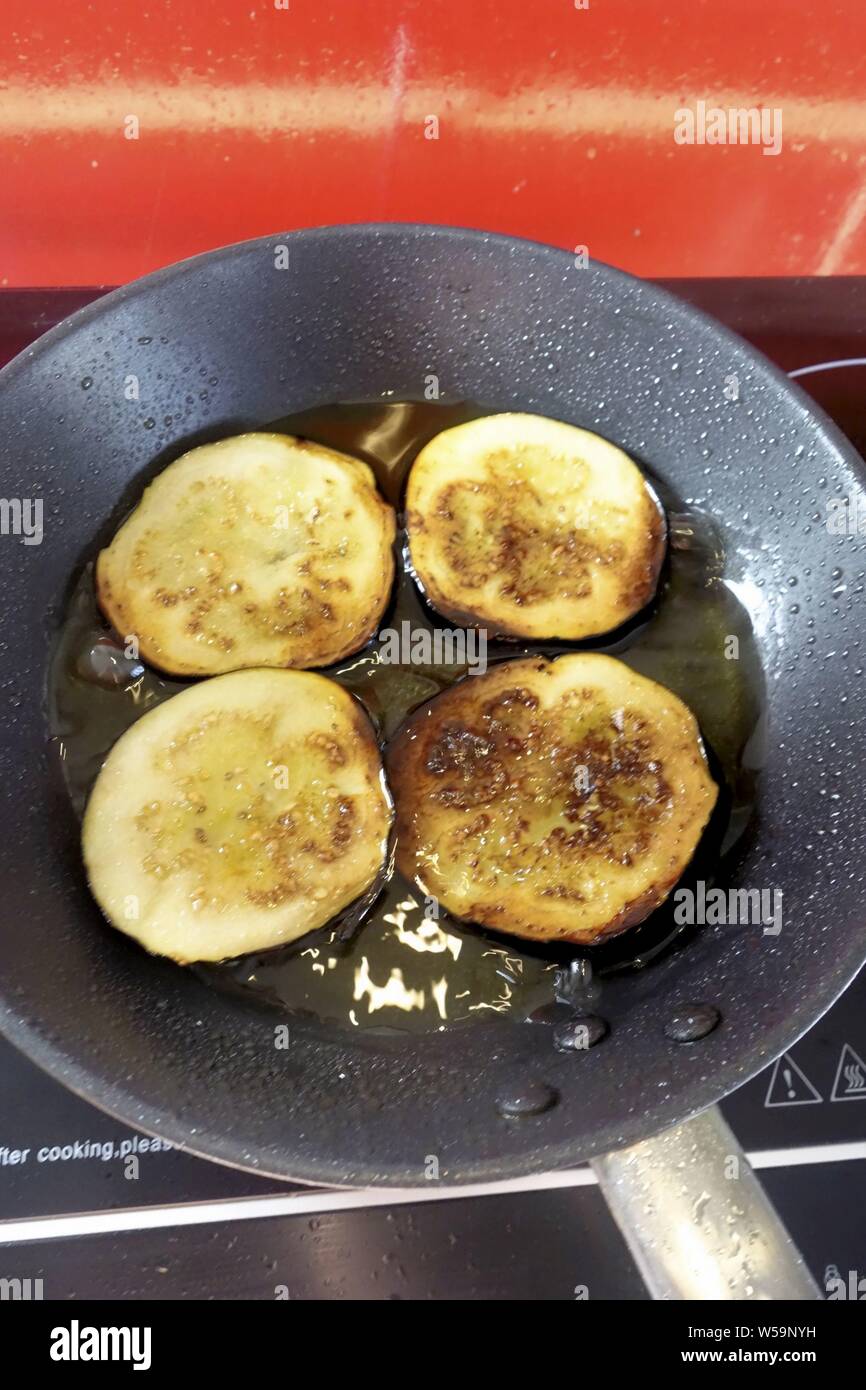 Deep Fried Aubergine Slices in a Frying Pan Stock Photo Alamy