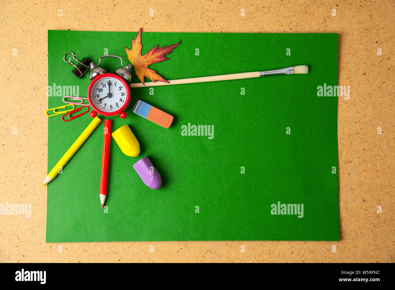 Back to school concept. Alarm clock and school supplies. Copy space. Stock Photo