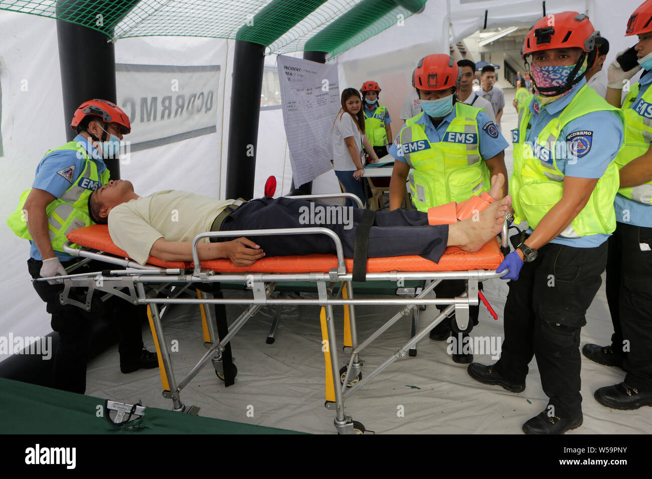 Philippine Rescuer Model Quezon City, Philippines. 27th July, 2019. Rescuers attend to a mock ...
