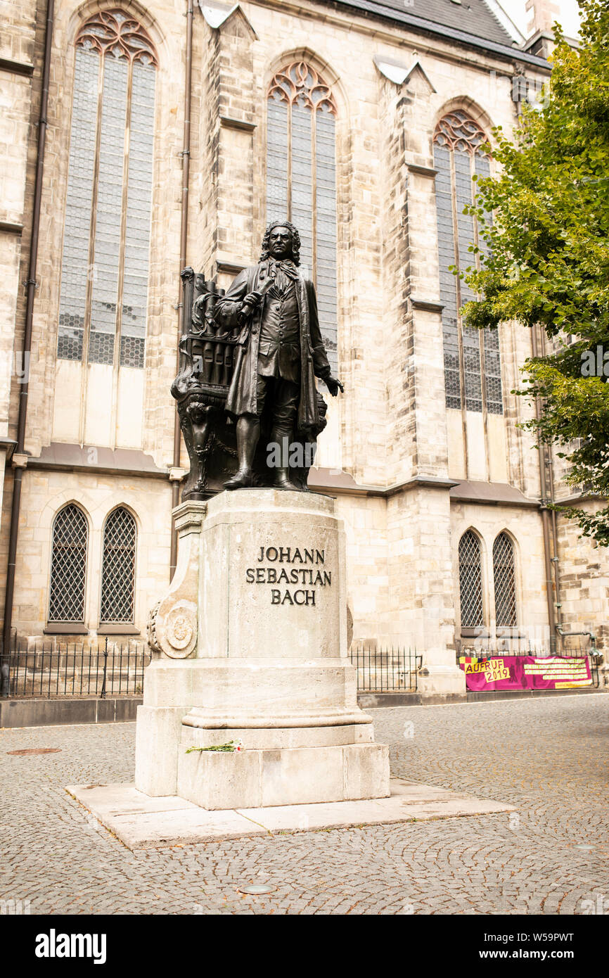 The Neues Bach Denkmal (memorial statue) of Johann Sebastian Bach outside the Thomaskirche on Thomaskirchhof in Leipzig, Germany. Stock Photo