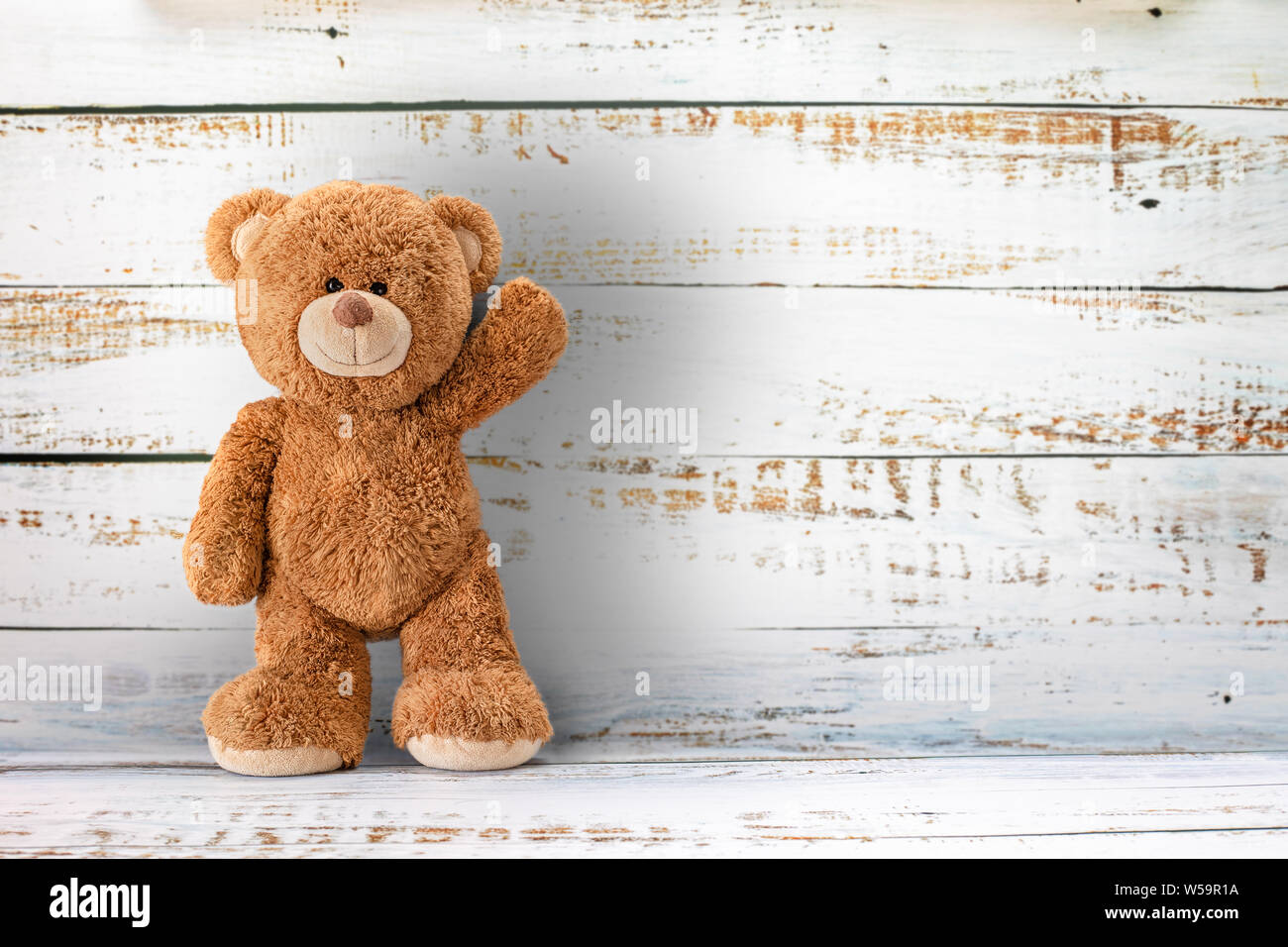 Cute teddy bear with copy space on white color wood background Stock ...