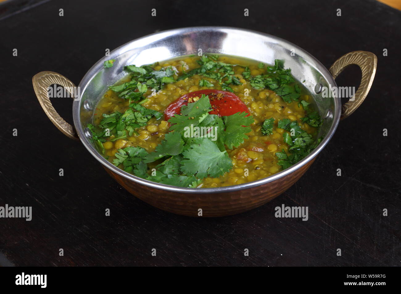 Indian lentil soup with cilantro and lime Stock Photo Alamy
