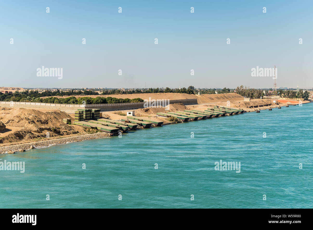 Suez, Egypt - November 5, 2017: Pontoons bridge for crossing the Suez Canal lie on the shore of canal near Suez, Egypt. Stock Photo