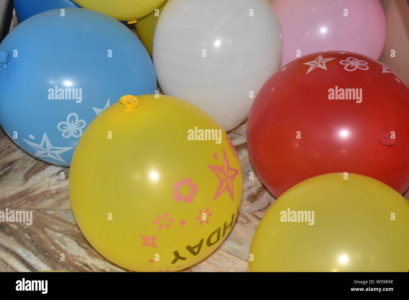 COLORFUL BALLOONS IN THE FLOOR Stock Photo - Alamy