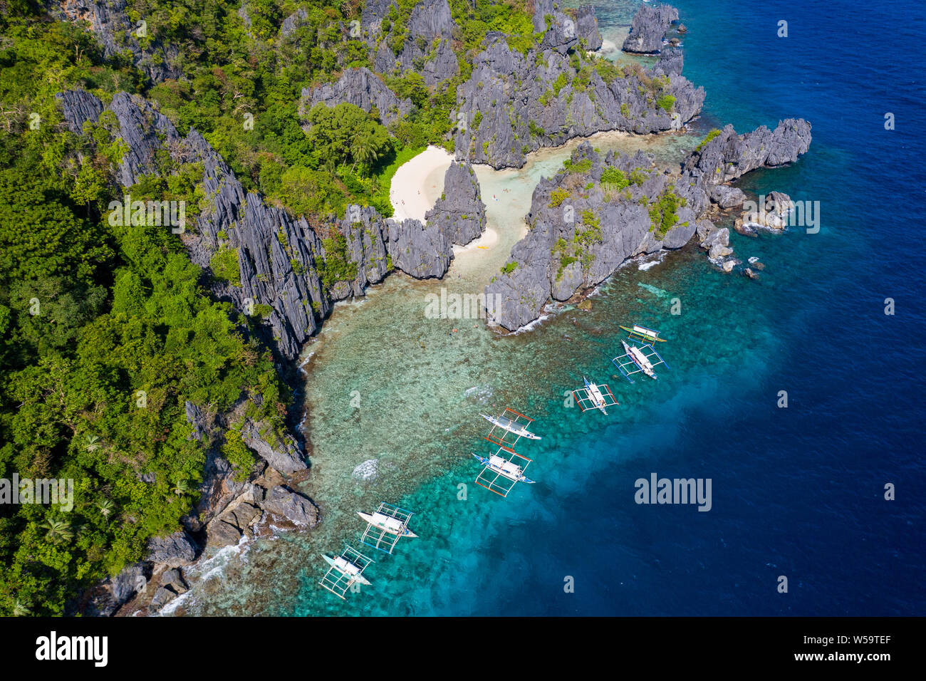 Aerial view taken with a drone of Banca outrigger boats moored at Hidden beach,El Nido,Palawan,Philippines Stock Photo