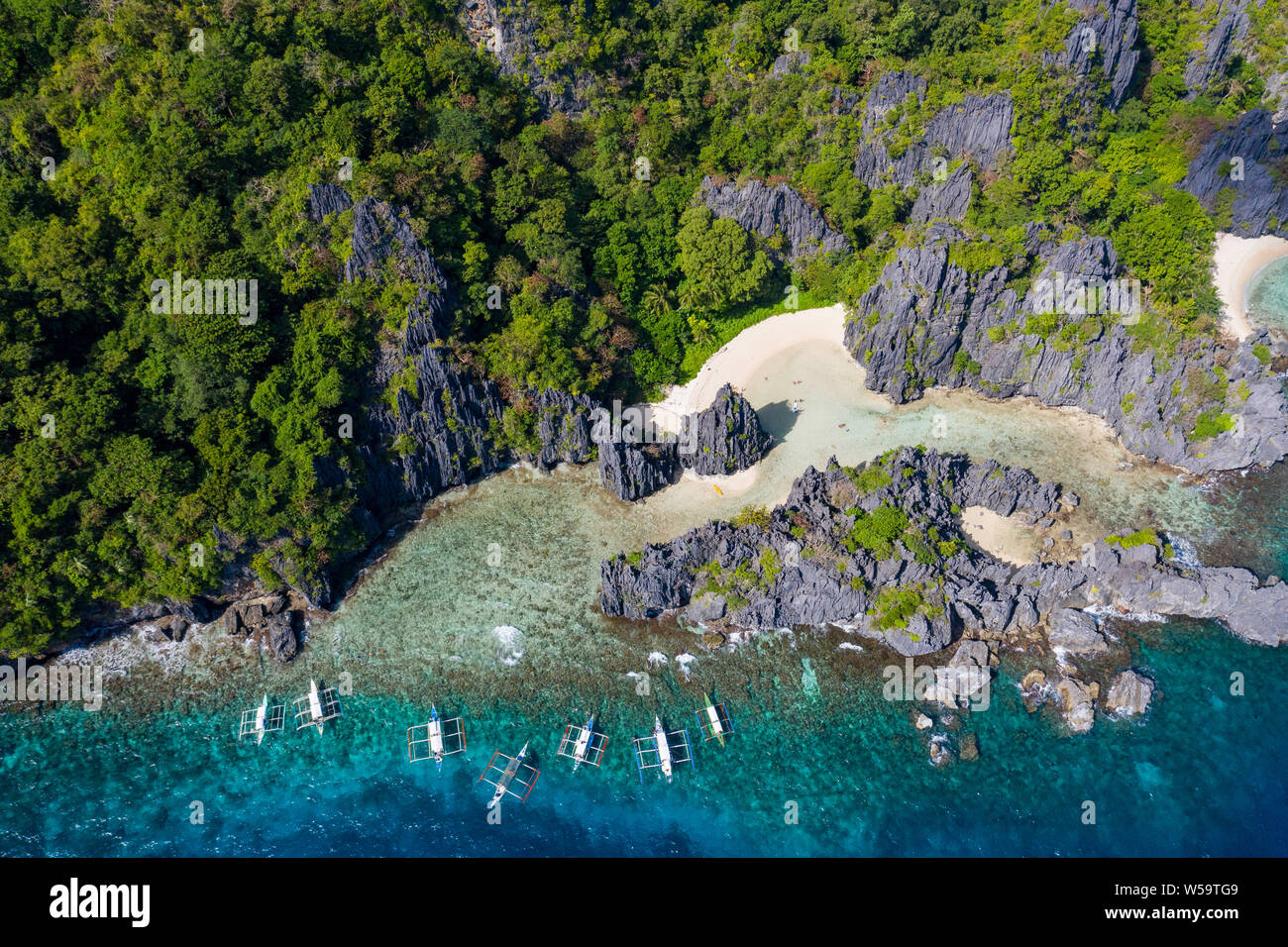 Aerial view taken with a drone of Banca outrigger boats moored at Hidden beach,El Nido,Palawan,Philippines Stock Photo