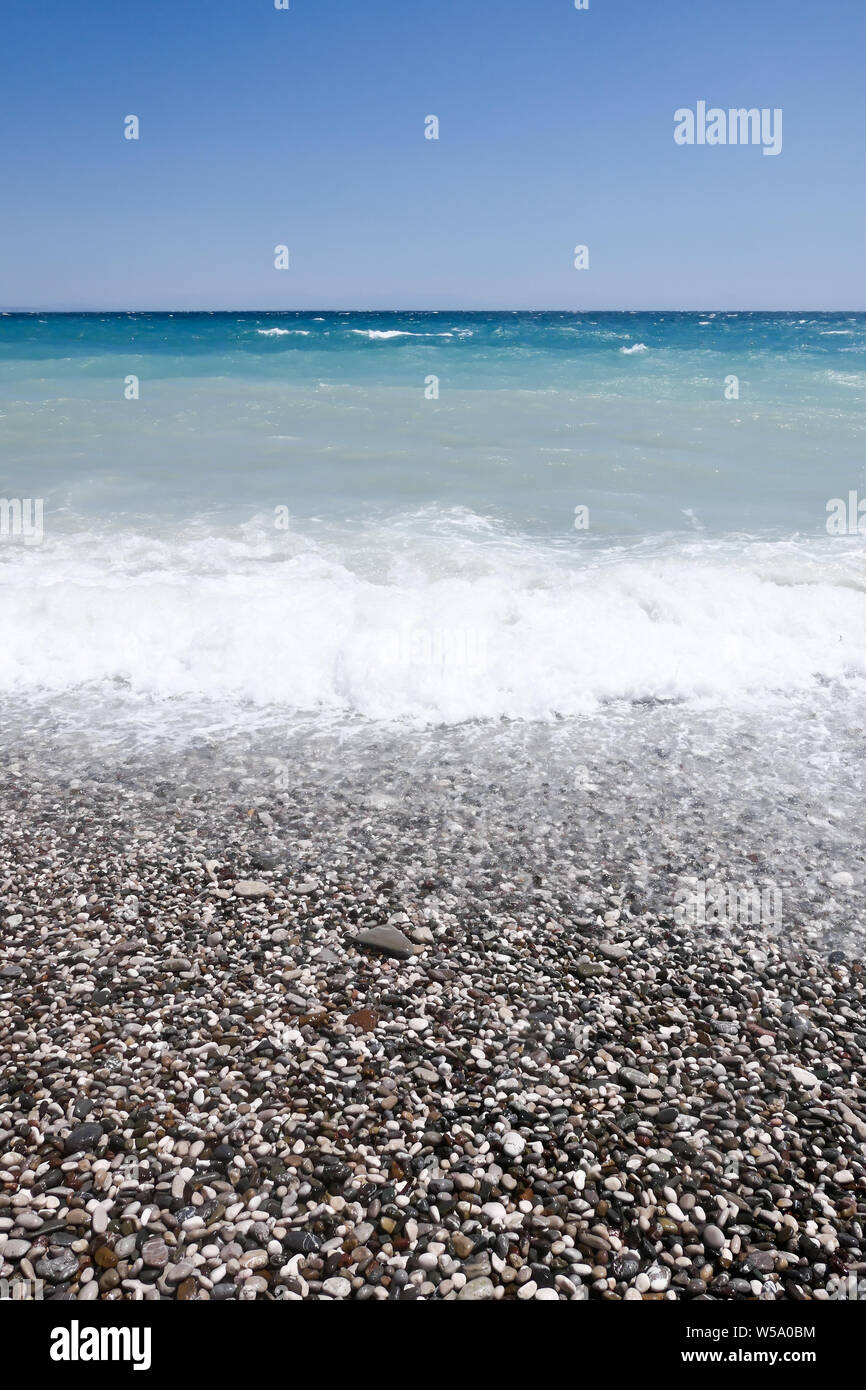 Pebble beach and beautiful sea Stock Photo - Alamy