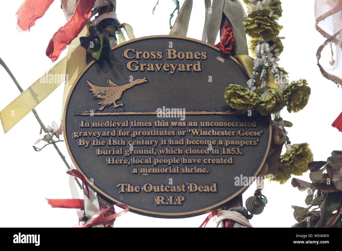 The outcast dead, cross bones graveyard plague Stock Photo