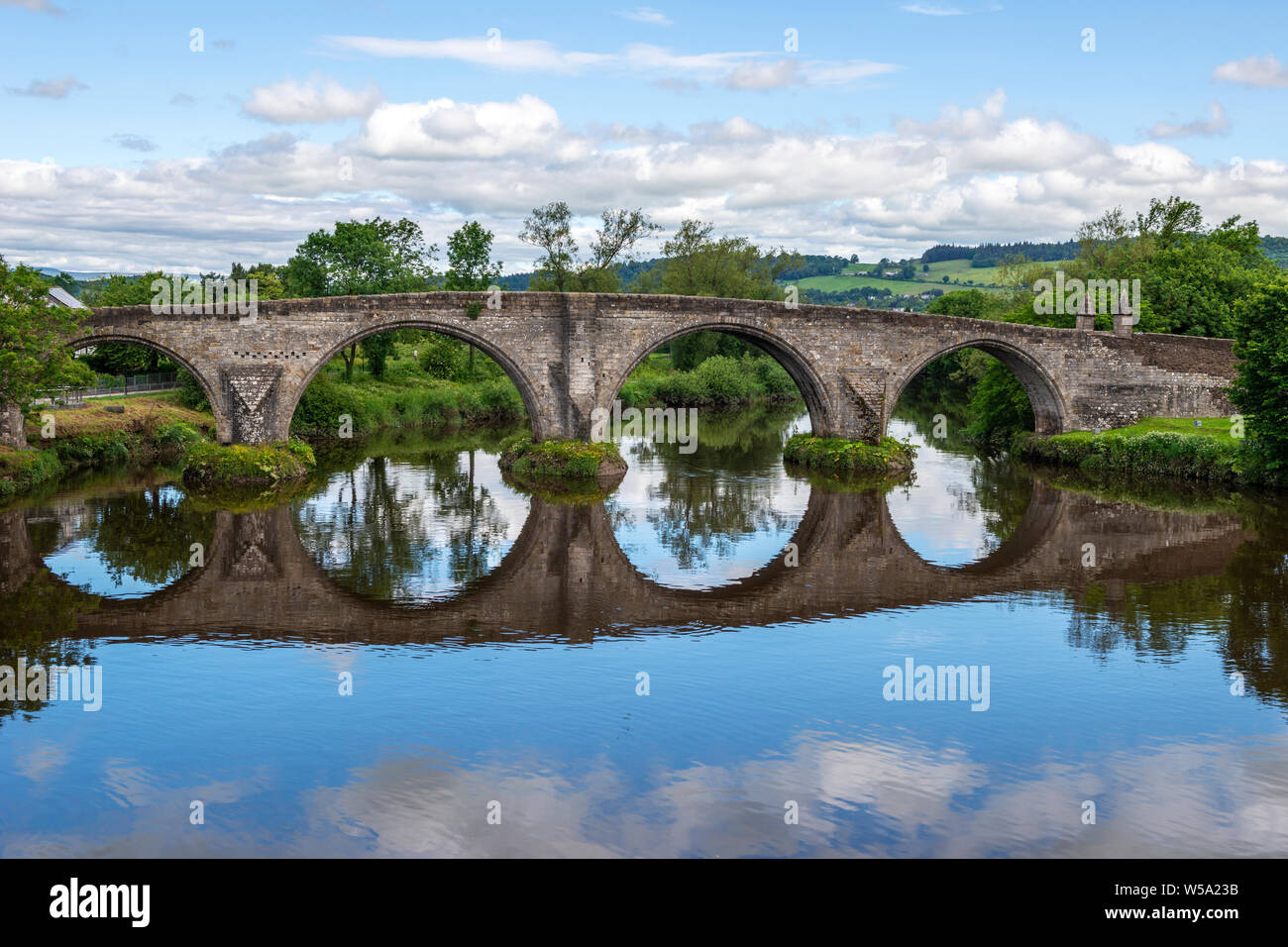 Old Stirling Bridge reflected in the River Forth at Stirling, Scotland, UK Stock Photo