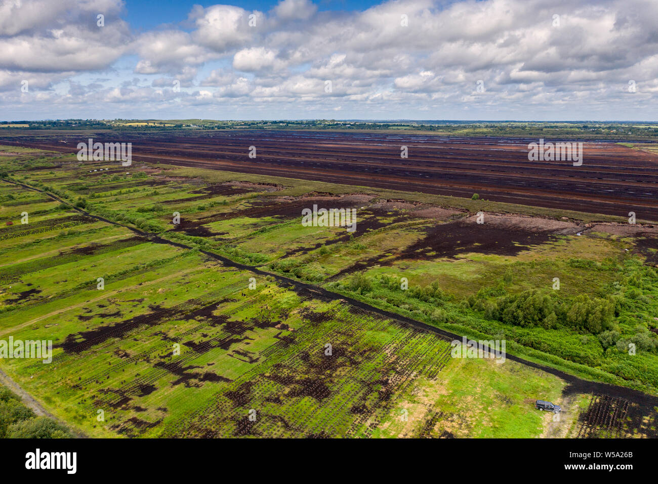 Aerial image of Bord Na Mona turf and peat bogs in the Irish countryside, County Kildare, Ireland Stock Photo