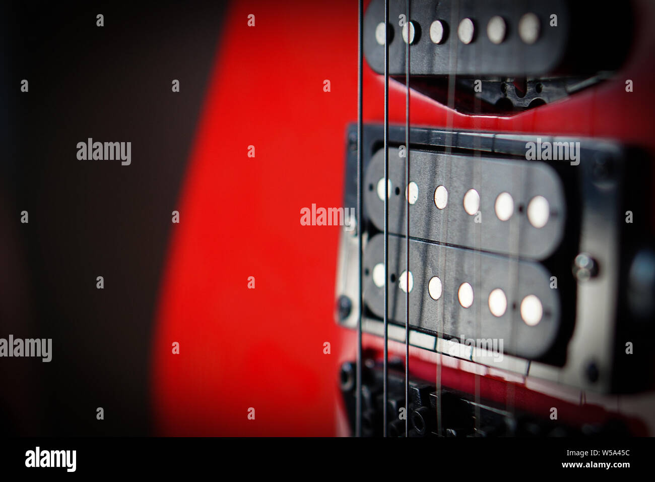 Close-up electric guitar sunbeams musical card. Musical string instrument, a good idea for music. Stock Photo