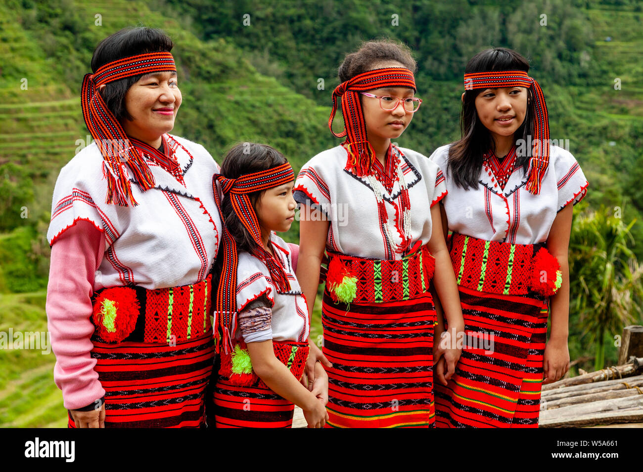 A Filipino Family Pose For Photos Wearing Traditional Ifugao Tribal Costumes, Banaue, Luzon, The Philippines Stock Photo