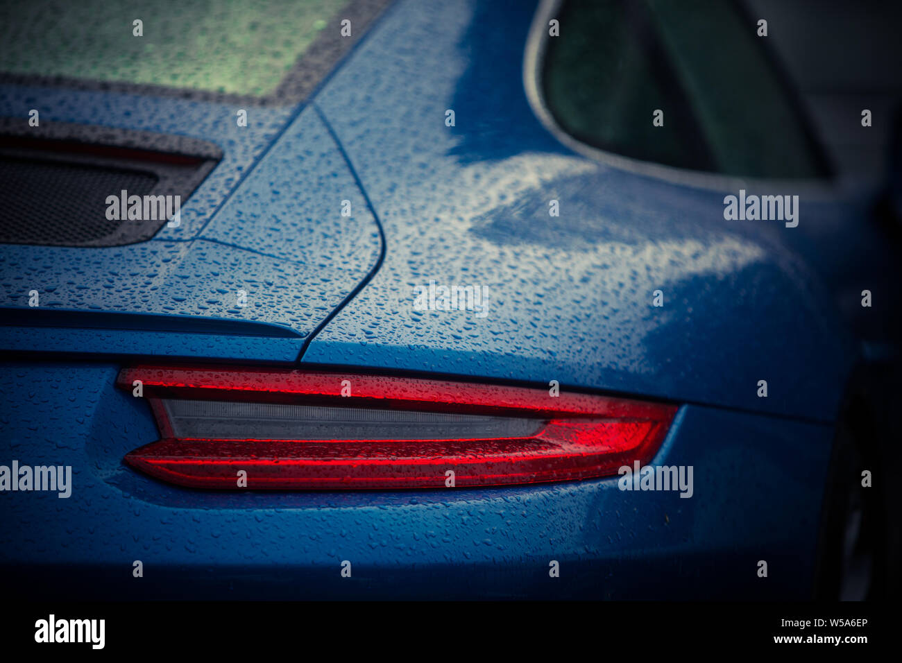 Close up horizontal image of the LED tail lights of a new sport super