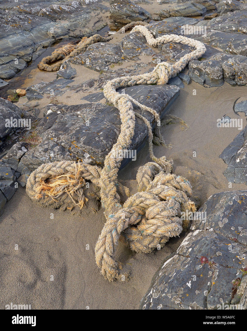 Isle Blocking Rope Old rope on beach, Sanaigmore, Isle of Islay, Argyll, Scotland Stock ...