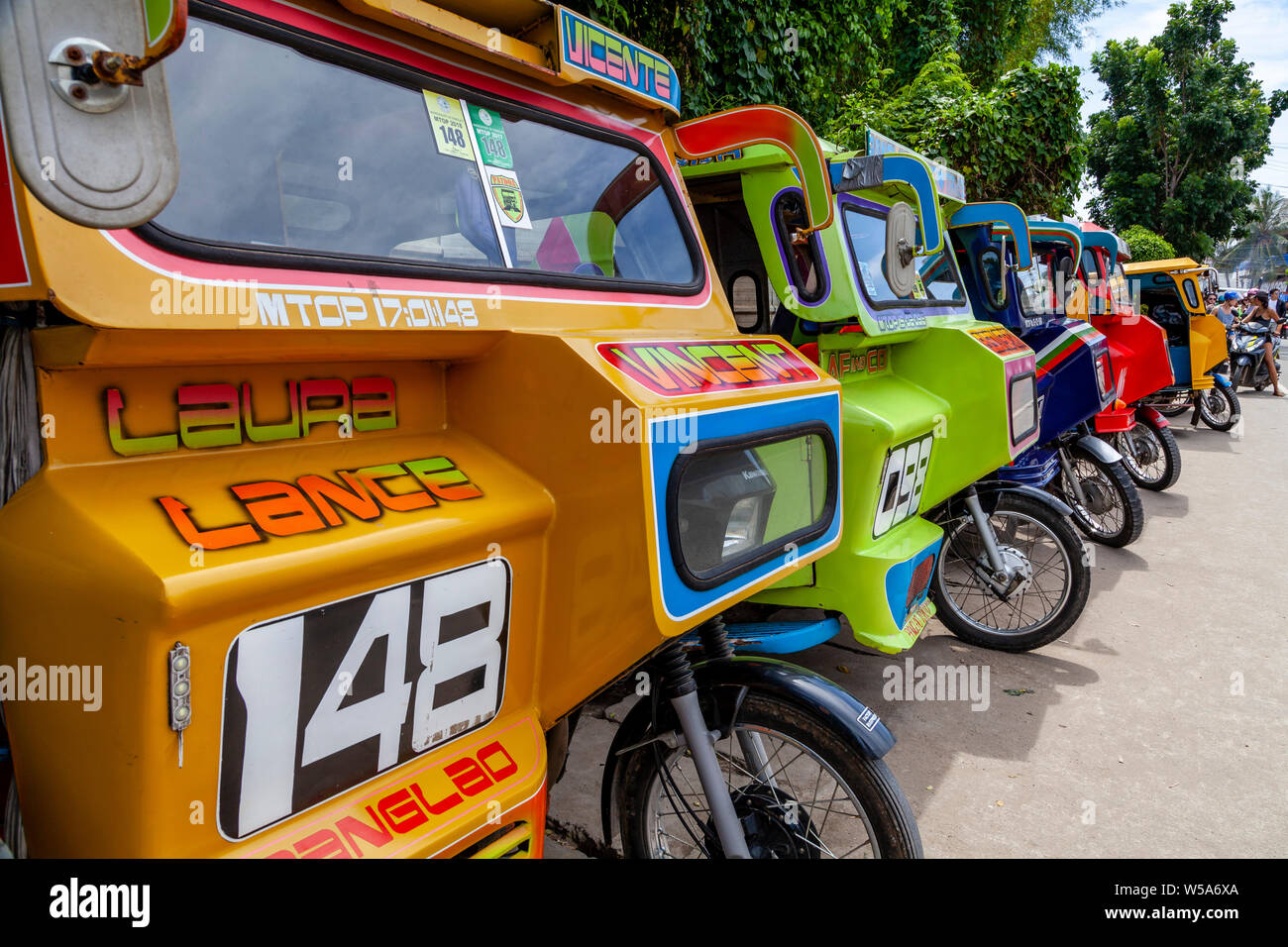 A Row Of Colourful Tricycles, Alona Beach, Bohol, The Philippines Stock Photo Alamy