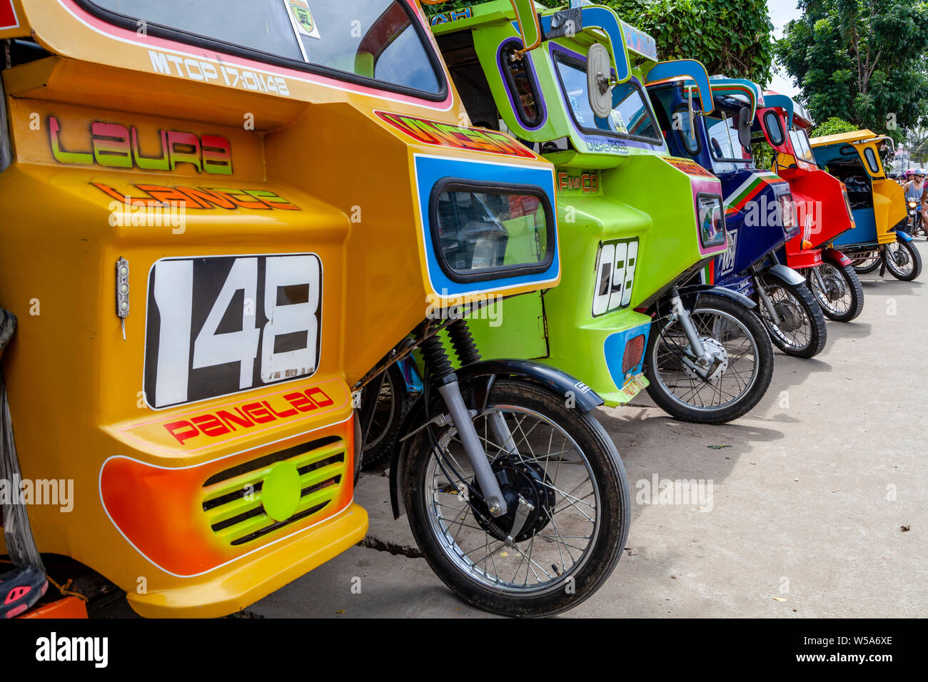A Row Of Colourful Tricycles, Alona Beach, Bohol, The Philippines Stock Photo Alamy