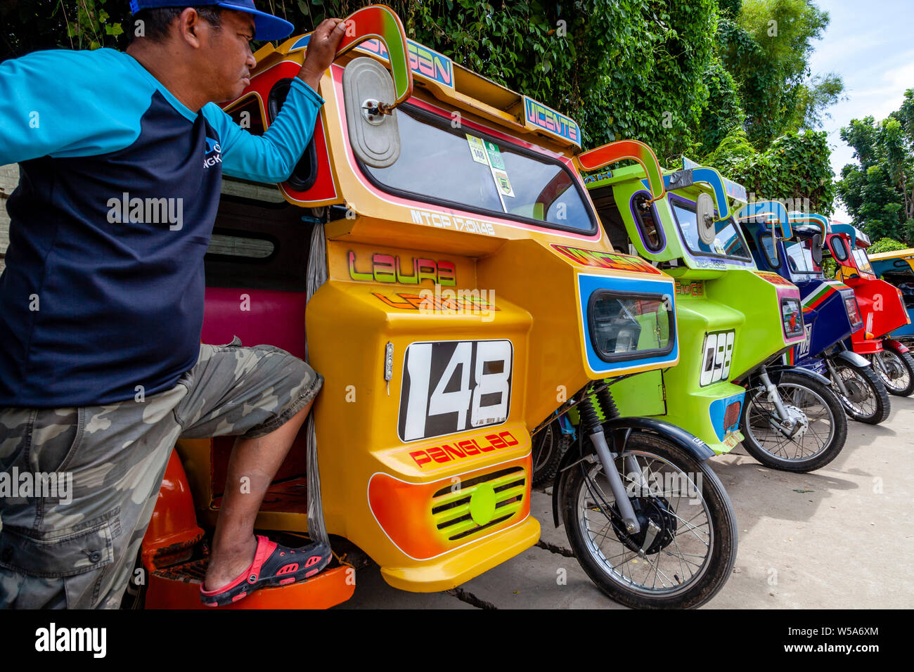 A Row Of Colourful Tricycles, Alona Beach, Bohol, The Philippines Stock Photo Alamy